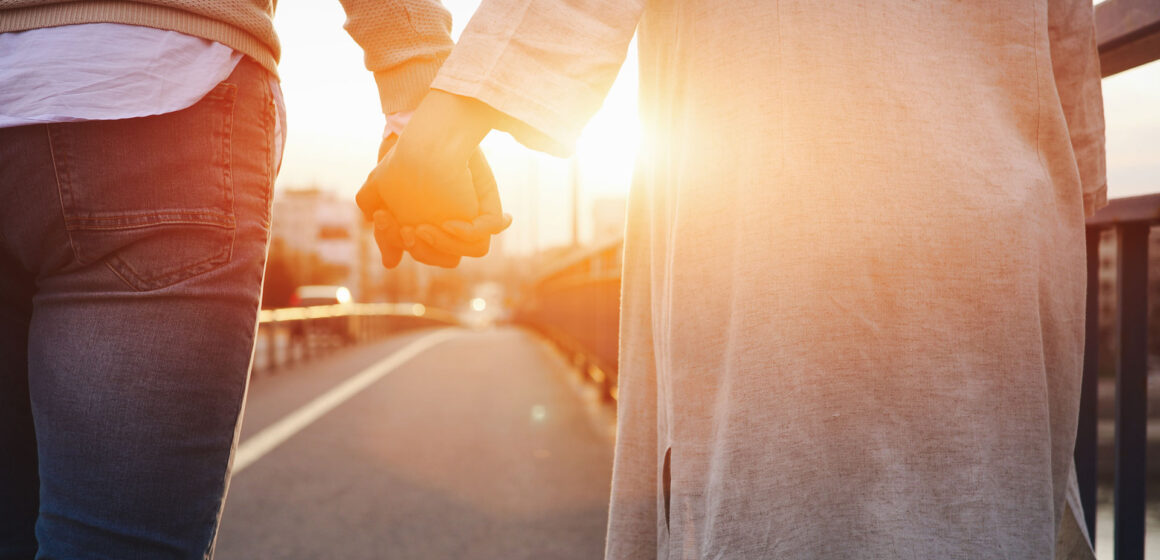 Becky-Lennox-happy-couple-holding-hands-in-the-sunset-2026-01-09-00-26-36-utc